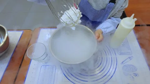 The child is preparing food. Master class for children. Children make ice cream. Stock Footage 299018316