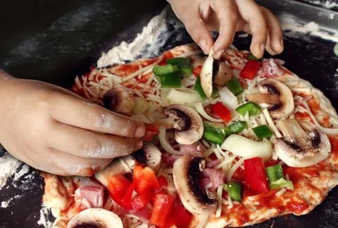 Child preparing pizza Stock Illustration