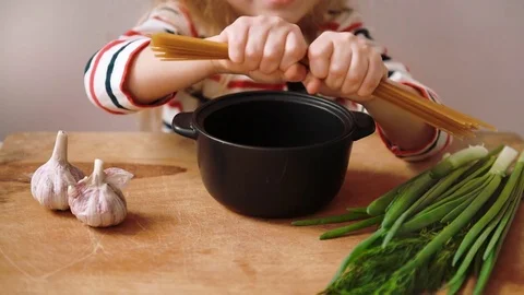 Child preparing spaghetti Video stock 73621019