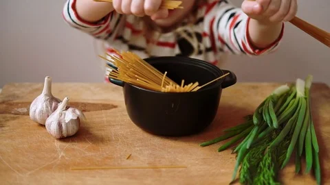 Child preparing spaghetti Stock Footage 73621172