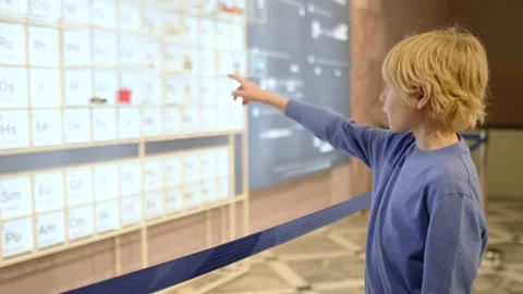 A child of primary school age visiting a science museum Stock Footage 261621259