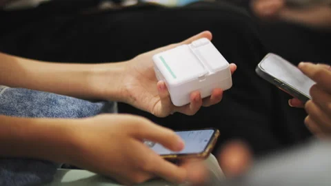 A child prints a photo on a mini printer Stock Footage 278975405
