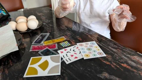 Child In Protective Gloves Preparing For Creative Egg Painting Art Project Fotos Stock