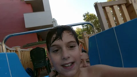 Child pulling down a water slide Stock Footage 119694238