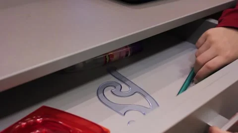 The child pulls out a drawer marker Stock-Footage 50810865