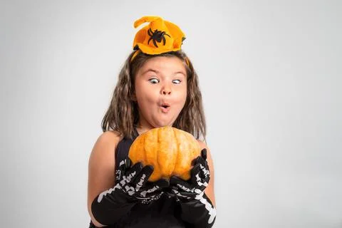 Child with a pumpkin Stock Photos