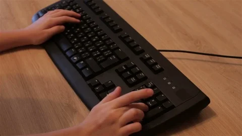 A child pushes a button on the keyboard Stock Footage 70942323