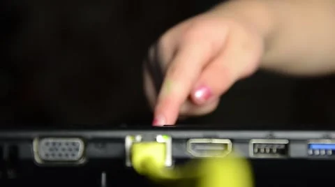 A child pushes a button on the laptop. Stock Footage 45423495