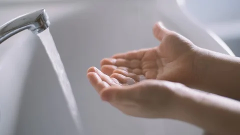 The child puts soap in his hands and washes them in the bathroom. Hygiene Video stock 128177860