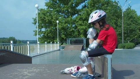 A child is putting on a roller. Stock Footage 78215364