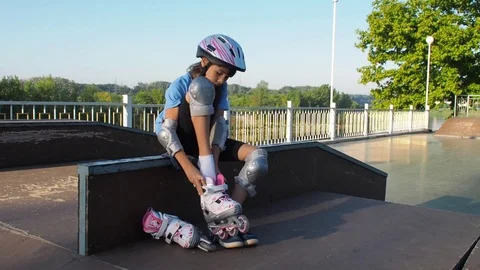A child is putting on a roller. Stock Footage 80231773