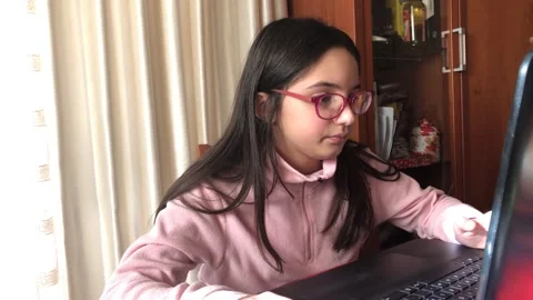  child in quarantine home with computer  during school lesson at home  Video stock 145415136