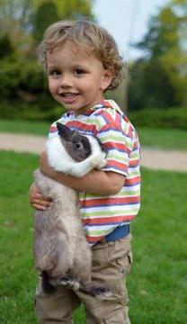 Child with Rabbit Stock Photos