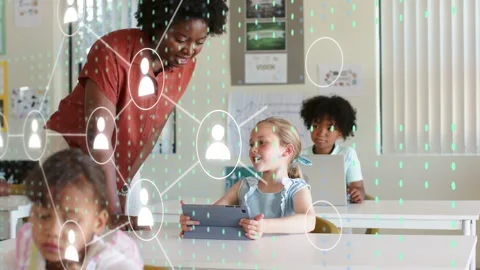 Child raising hand using tablet for help in classroom, teacher leaning, data 库存影片 334321845