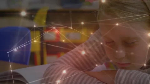 Child reading book in classroom, initiating translucent network overlay mapping Stock Footage 311505366