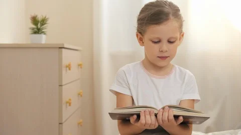 Child reading book Video stock 92781144