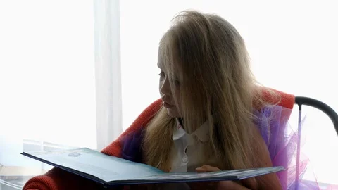 Child is reading a book Stock Footage 124488379