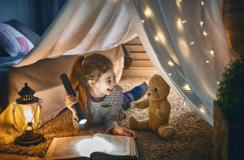 Child is reading a book Stock Photos