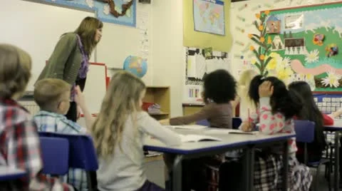 Child reading in front of class Stock Footage 22637472
