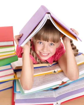 Child reading open  book on table. Stock-Fotos