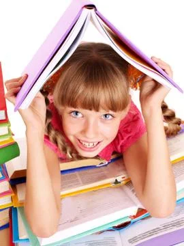Child reading open  book on table. Stock-Fotos