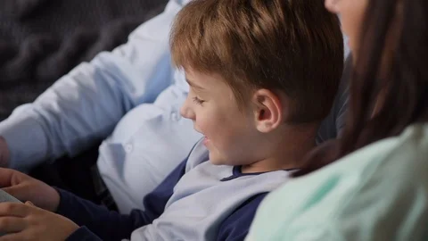 Child is reading with parents Video stock 88322185