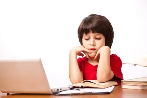Child reading a textbook Stock Photos