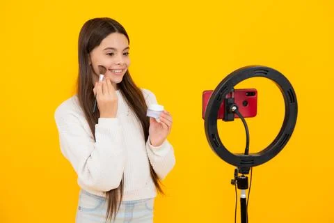 Child recording video tutorial for social media with smart phone. Influencer Stock Photos