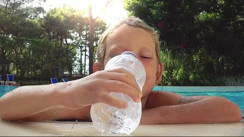 Child refreshing in swimming pool Stock Footage 78481718