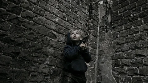 Child refugee with arms. War. Stock Footage 90449607