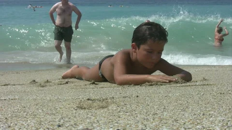 Child relaxing on the beach Stock Footage 41600775