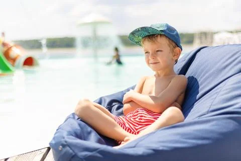 Child Relaxing by the Poolside Stock Photos
