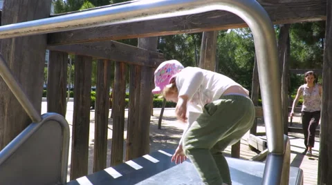 Child repeating in slide Stock Footage 65106272