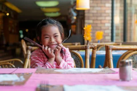 Child at restaurant's table 스톡 사진