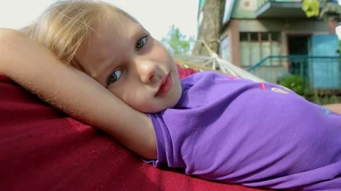The child is resting on the hammock Stock Footage 80997034