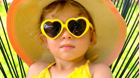 The child is resting in sunglasses. Selective focus. Stock Footage 245607771