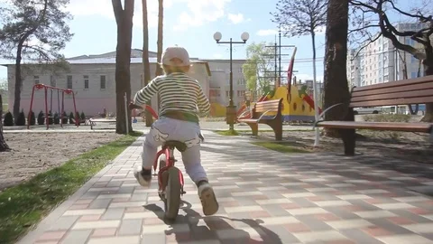 A child rides bicycle Stock Footage 73289856