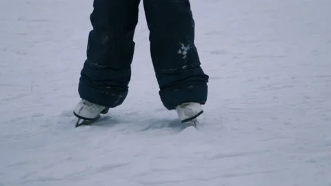 Child Rides on Figured Skates on an Ice Rink Stock-Footage 145708973