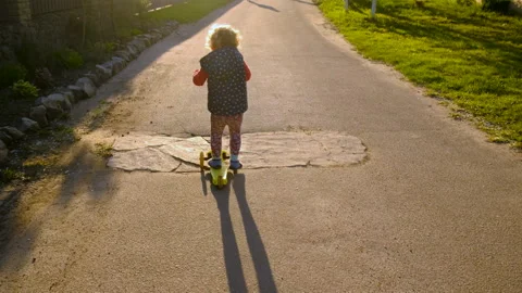 A child rides a scooter. Selective focus. Stock Footage 256432876
