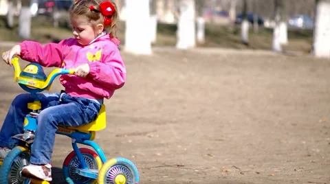 A child riding a bicycle Stock Footage 59605551