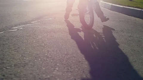 The child is riding a bicycle in summertime Stock Footage 78036788
