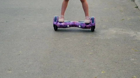 Child riding a hoverboard. Selective focus. Video stock 306055706