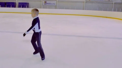 A Child Riding on Ice Stock Footage 69999694