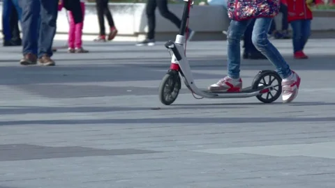 The child is riding a scooter. Stock Footage 75756526