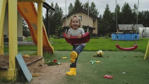 The child is riding a swing Video stock 137875287