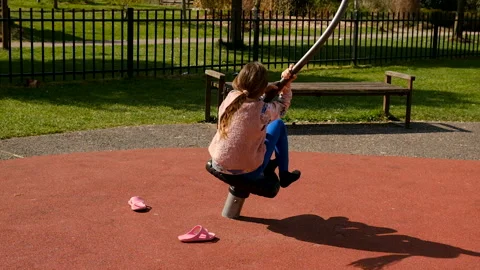 A child is riding on a swing. Selective focus. Stock Footage 303600261