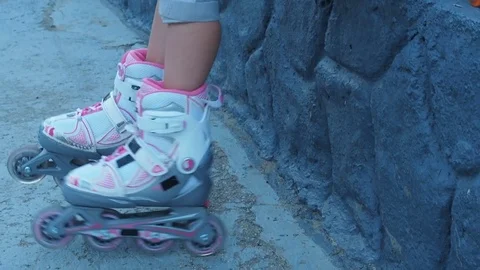 Child on the rollers in the helmet. Stock Footage 78149038