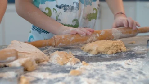 Child rolling dough Stock Footage 124950096