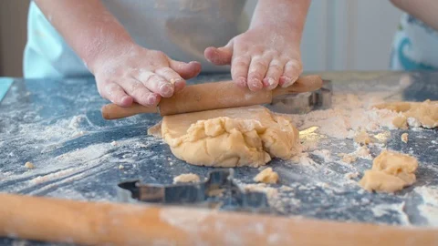 Child rolling dough Stock Footage 124950173