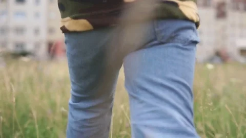 Child running across to children's playground, rear view Stock Footage